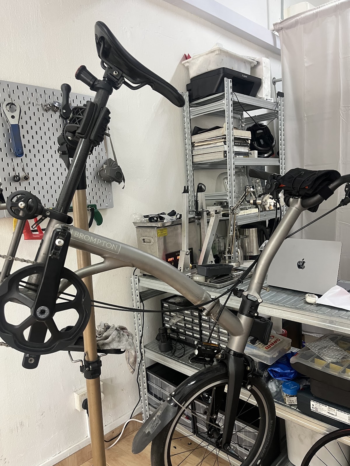 Titanium Brompton in the workshop beside the ultrasonic cleaner
